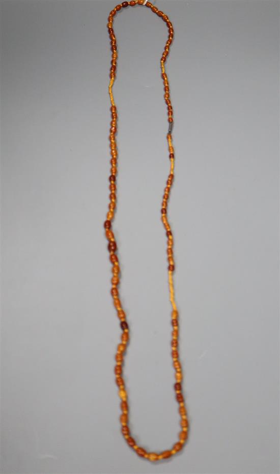 A single strand graduated oval amber bead necklace, 108cm, gross 18 grams.